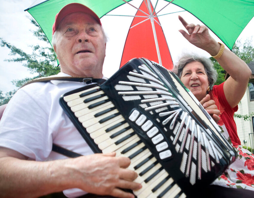 Armando Natale, of Cortland, plays an accordion at the 2015 St. Anthony's Festival processional. The event returns with a spaghetti dinner Saturday and continues throughout next week.