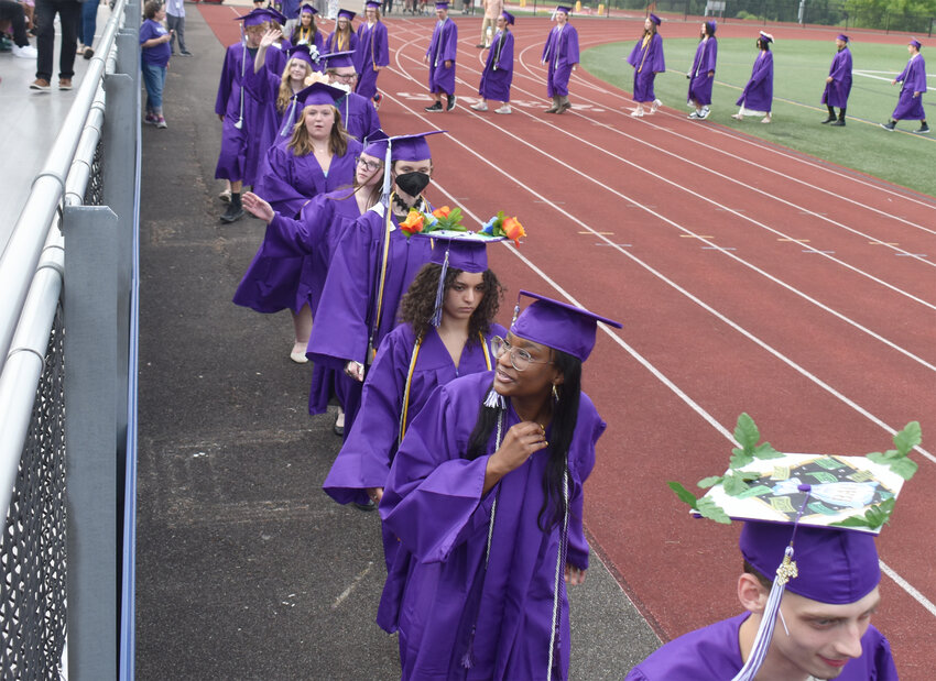 The Cortland Junior Senior High School Class of 2024 walks together for the last time Friday before students embark on their different roads.