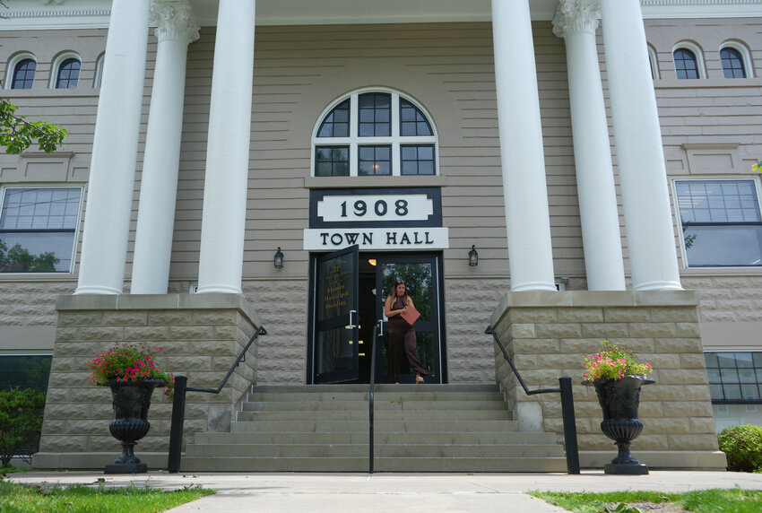 Ashley Barnard of Homer picks up her marriage license from the Homer Town Hall, 31 N. Main St. Joseph Rivers Painting, based in Homer, finished repairs to the front of the building earlier this month. Repairs include: pressure washing, scraping, brushing, caulking, priming, painting, masonry repointing and carpentry work.