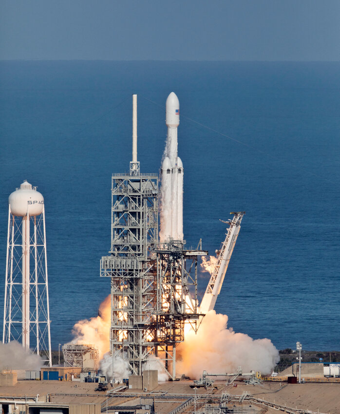 SpaceX Falcon Heavy rocket launches in 2018 from Launch Complex 39A at NASA's Kennedy Space Center in Florida. NASA and SpaceX recently launched the 10th Falcon Heavy, carrying a new environmental satellite.