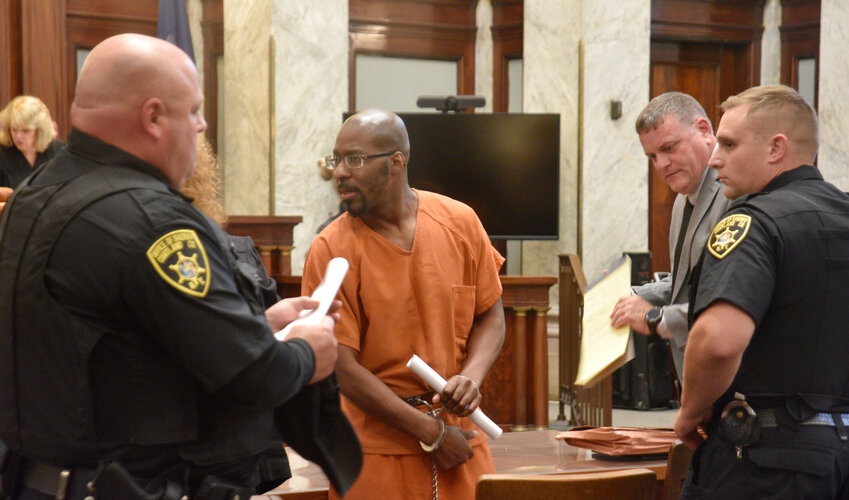 Tyshawn Pittman, center, is led Thursday from Cortland County Court after he was sentenced to 22 years in prison for attempted second-degree murder and other charges in connection with a December 2022 shooting in downtown Cortland.
