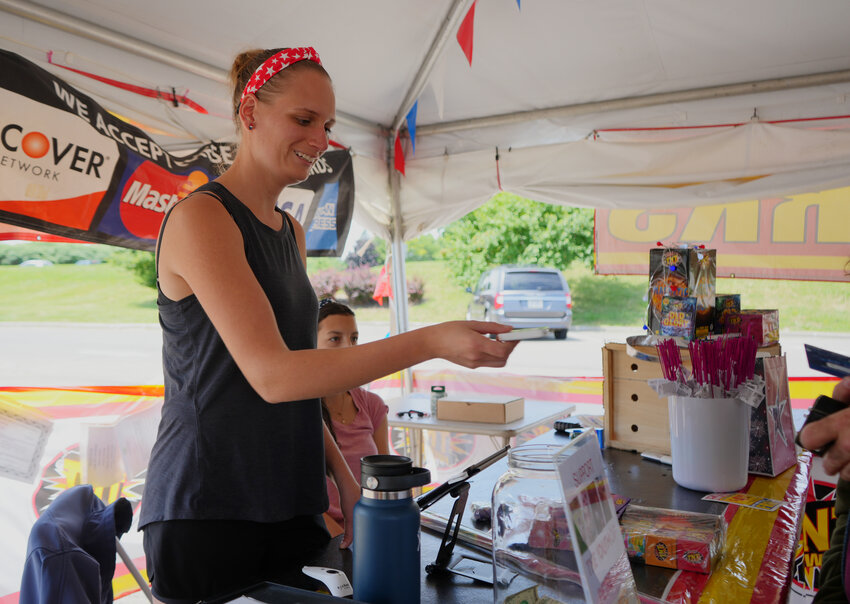 Ellie Potter, owner of TNT Fireworks in Cortlandville, sells fireworks ahead of the Fourth of July celebrations.