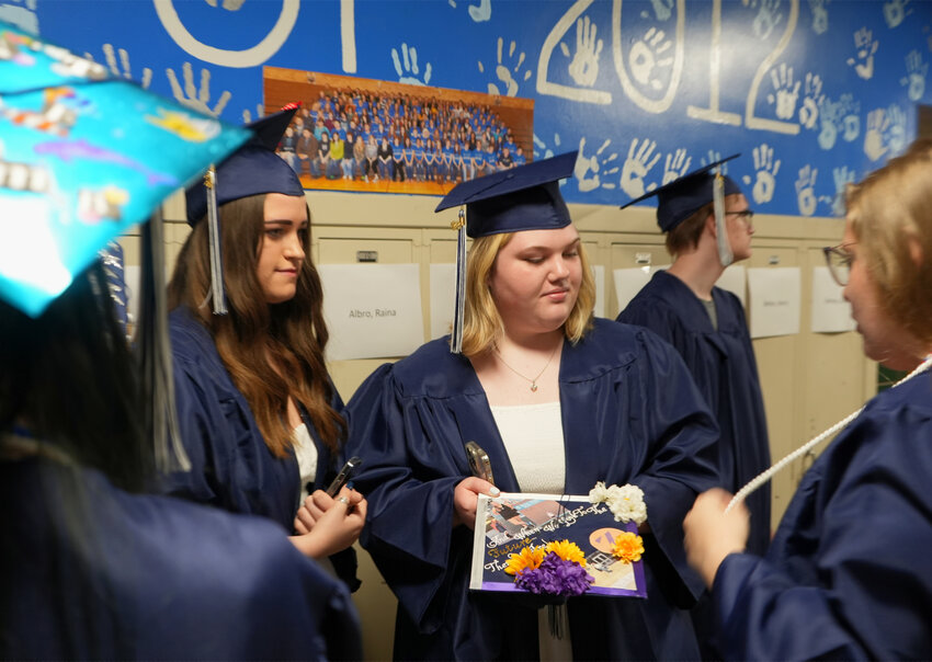Janelle Hess, left, and Grace Lancaster graduated last month from Homer High School. The two were in 8th grade when COVID lockdowns started in 2020 -- resulting in them missing much of their high school experience and dealing with the stress and anxiety that came because of the pandemic.