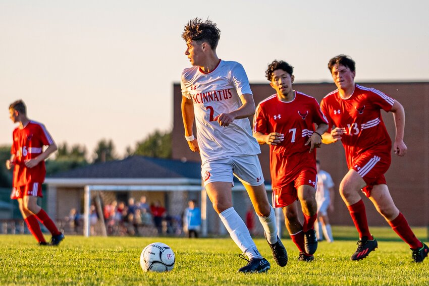 Cincinnatus’ Jack Stafford, front, looks for an opening against Fabius-Pompey Thursday at Fabius-Pompey Jr./Sr. High School. The Lions fell to the Falcons 4-0.