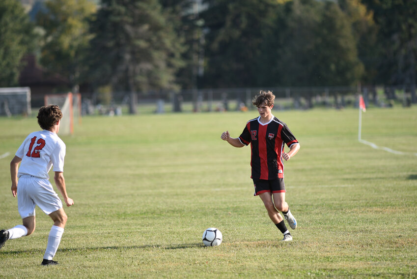 Tully's Ryan Rauber, right, looks to make a move past Marathon's Nash Coleman Monday at Tully High School. Rauber scored the game's lone goal in a Tully win.