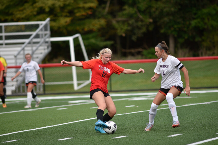 Groton's Jill Zigenfus, left, Stella Holl, center, and Madison Lockwood, right, watch before Marathon takes a corner kick Wednesday at Ross Field.