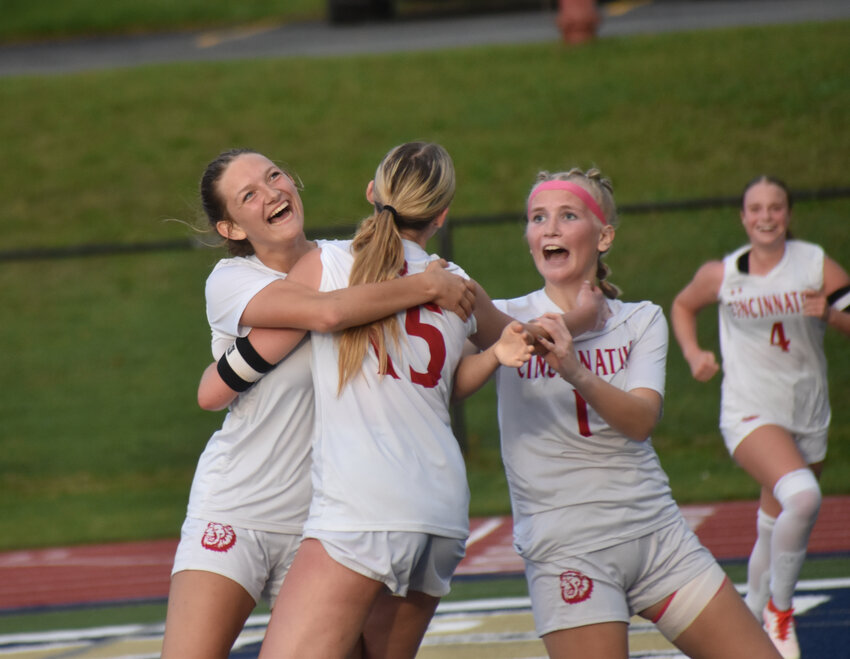 Cincinnatus' Lucy Finch, left, celebrates with Ava Larrabee, center, and Payton Landers, right, after Finch scored a goal Thursday at Skaneateles High School. Finch's goal capped a 3-0 win for the Lions.