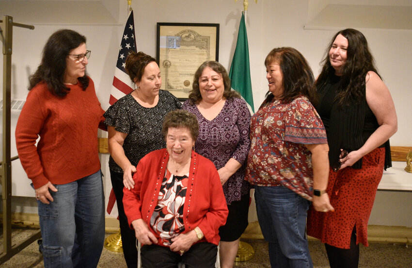 Adrienne Passeri-Bruno, left, Linda Riccardi, Stephanie Passeri-Densmore, Mika Pizzola and Ann Marie Capria, pose with Francesca Sciaruto in front of the Stella D'Oro proclamation at St. Anthony's Church. The group marks 90 years of Italian-American women gathering in Cortland.