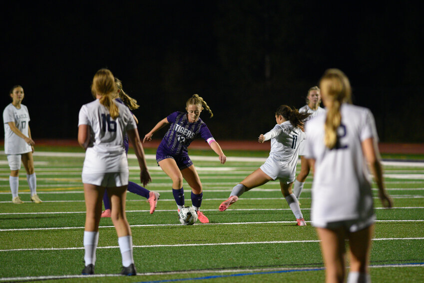 Cortland's Mackenna Bulger, center, makes a move to get past a Jordan-Elbridge defender Monday night at Cortland Jr./Sr. High School.