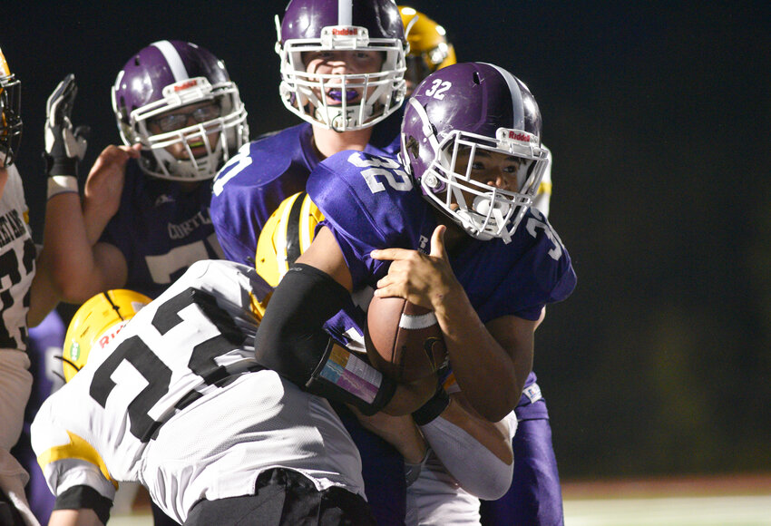 Cortland's Dante Wilson attempts to run through a South Jefferson tackle Friday night at Cortland Jr./Sr. High School.