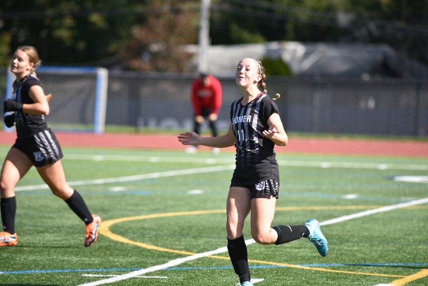 Homer's Emily Petrella celebrates after scoring a goal Saturday at Homer High School.