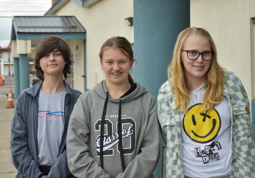 Julian Genson of Dryden, left, Leigh Eckstrom and Kaylee Lovall-Whittin, both of Cortland, stand outside the Cortland Youth Bureau. They were among the teens who created tombstones against nicotine use.