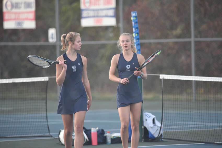 Homer's Emma Effinger, left, and Lauren Franco talk after a game Friday at Oneida High School. The duo won their second consecutive Section III championship Friday.