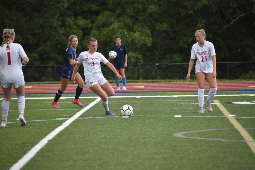 Cincinnatus' Mandi Waltz, center, plays a ball into the center of the field earlier this season.