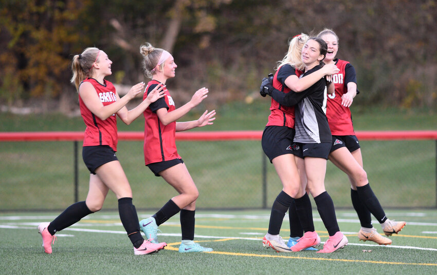 Groton's penalty kick shooters, left to right, Lauren Gallinger, Bailey Vliet, Devyn Blasz and Jill Zigenfus celebrate with goalie Stella Holl, black shirt, Tuesday at Ross Field. Holl stopped three of the four shots she faced in penalty kicks to secure the win for the Red Hawks.