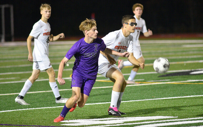 Cortland's Sawyer Bowman races after the ball Tuesday at Cortland Jr./Sr. High School. Bowman scored the opening goal in the Purple Tigers' 3-0 first round sectional win over Mexico.