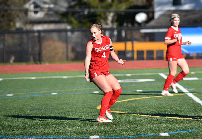 Cincinnatus' Ava Larrabee, center, plays a ball down the field during the 2024 season.