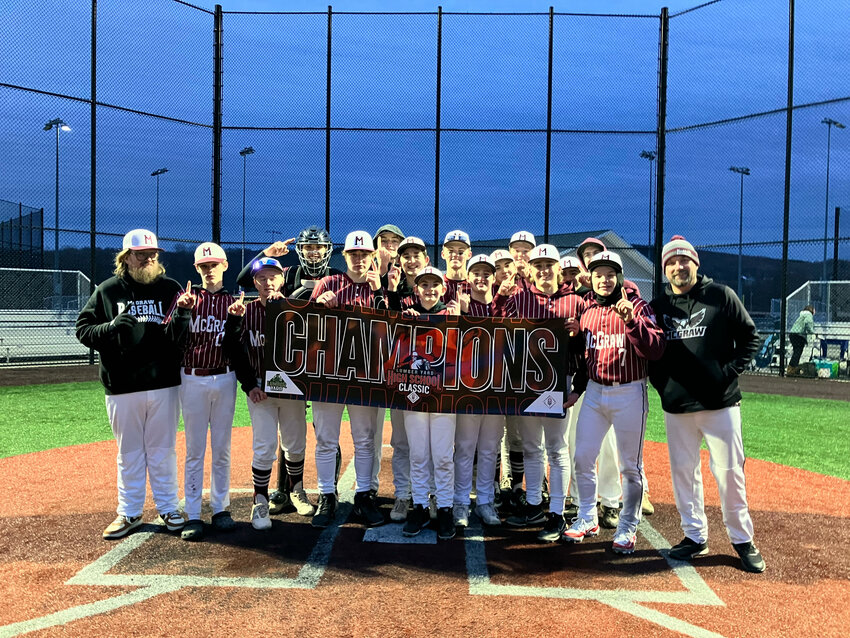 The McGraw baseball team poses for a photo after winning the PBR Lumber Yard High School Classic earlier this season.