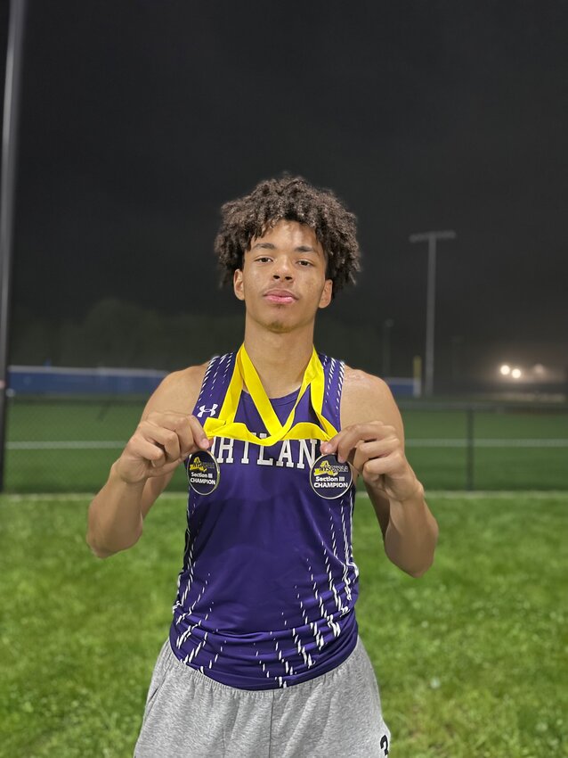 Iniko Abani poses for a photo with his two Section III championship medals.