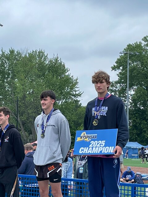 Moravia’s Joe Baylor stands atop the podium after winning a Class C state title Saturday in Middletown.