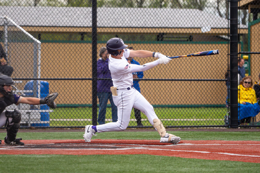 Caden Albright swings during a game earlier this year at Gutchess Lumber Sports Complex.