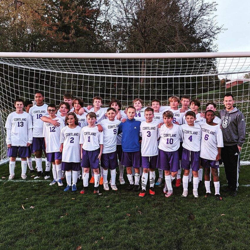 Austin Harriger (far right) poses for a picture after a game with his Cortland youth soccer team.