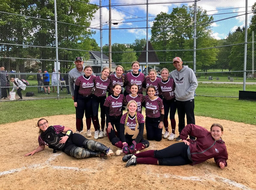 The McGraw softball team celebrates after a win at the Blodgett Mills Softball Field earlier this season.