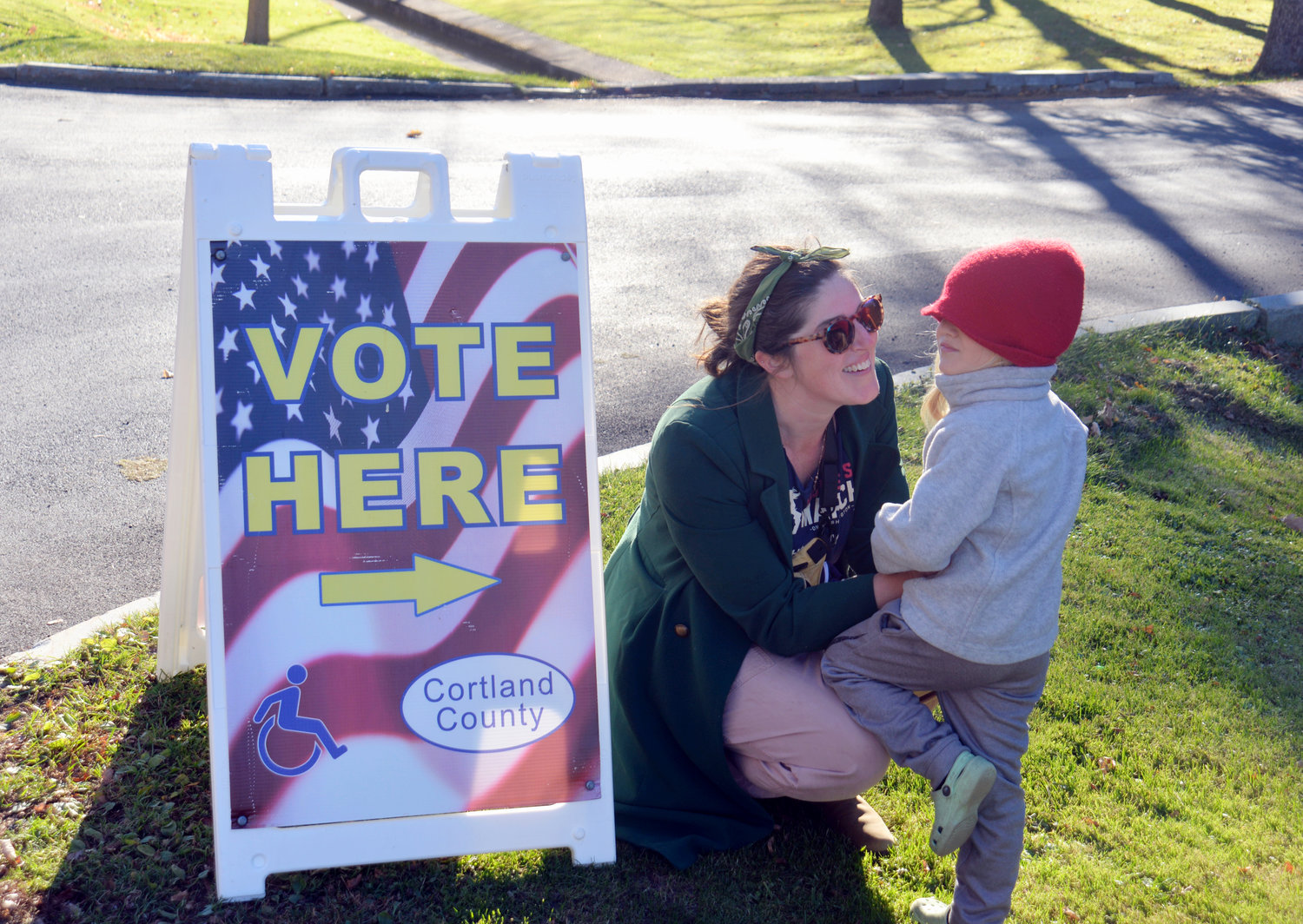 Emily Gibbons of Cortland and her son, 4-year-old Seamus Beck, stand outside a polling location, on the side of Broadway Avenue in Cortland shortly after voting Tuesday in the 2022 general election.