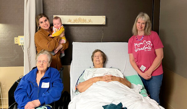 Danielle Schwartz holds Graham Schwartz as five generations of their family gather: Nellie Barber, left, the Schwartzes, Bonnie Young and Denise Young Cuddeback.