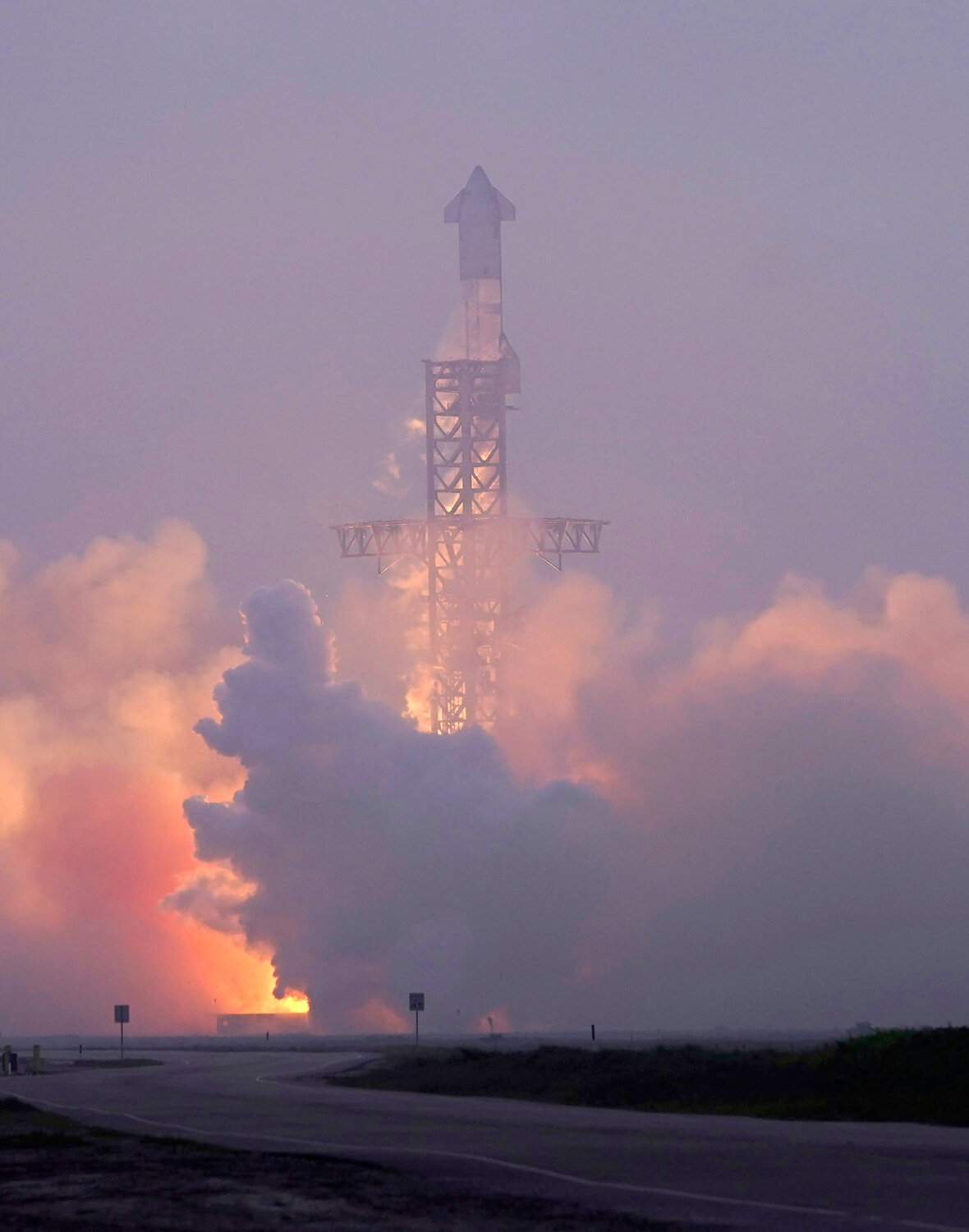 SpaceX's mega rocket Starship launches at dawn March 14 in the haze on its third test flight from Starbase in Boca Chica, Texas.