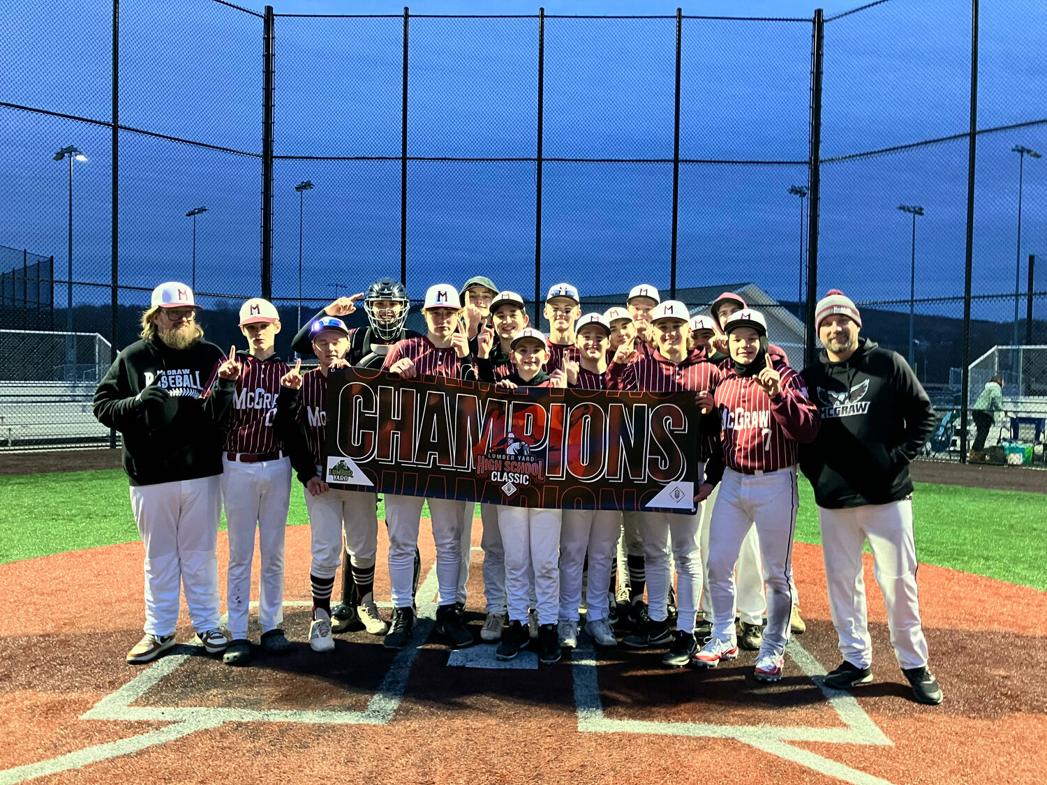 The McGraw baseball team poses for a photo after winning the PBR Lumber Yard High School Classic earlier this season.