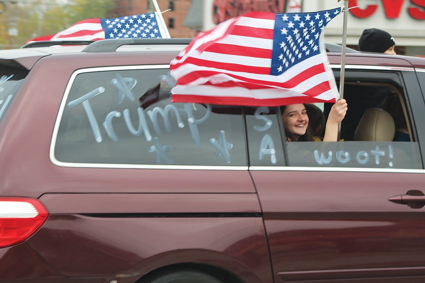 Cars and trucks adorned in patriotic colors, decorations and flags made their way through Crawfordsville on Sunday as part of an organized Trump Train event. Supporters of President Donald Trump honked their horns and chanted &ldquo;four more years.&rdquo;