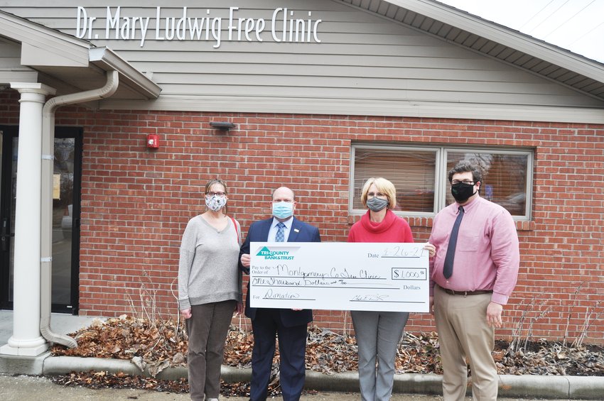 Tri-County Bank &amp; Trust will donate $1,000 annually over the next five years to the Montgomery County Free Clinic. This year&rsquo;s donation will cover operating expenses and some technology needs including updating laptop computers, executive director Kay Nannet said. The clinic has seen an increase in patients during the COVID-19 pandemic, such as in the dental clinic. A new dental hygienist has been hired. Pictured from left are Nannet; Steve McLaughlin, Tri-County vice president of business development; Donna Hendrickson, clinic board president; and Brandon Peacock, Tri-County South Boulevard branch manager.