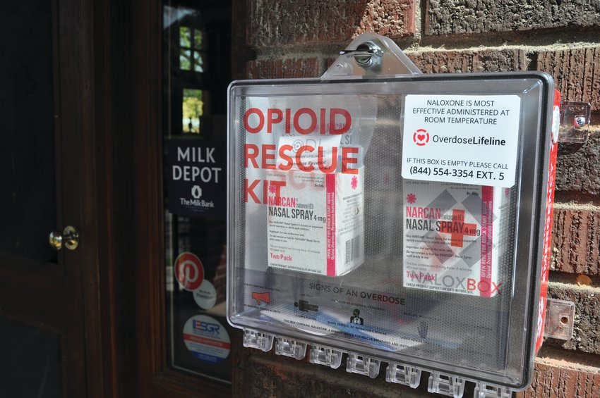 A NaloxBox hangs on the wall of the Community Paramedicine building. The box is stocked with Narcan, instructions for use and nformation about treatment services.