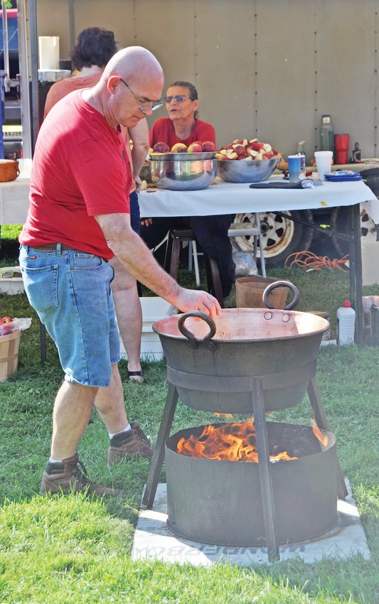 Phil Pirtle makes apple cider at Waynetown Oktoberfest at the Rev. Guy Tremaine Park.