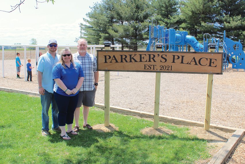 Clinton Schroll, from left, Lenna Schroll and Jeffrey Schroll dedicate Parker&rsquo;s Place on Friday at Walnut Elementary for son Parker Schroll who passed away in May last year following a fatal car crash. A 2020 Southmont graduate, Parker loved his days as a Walnut Flyer. A dedication ceremony was held Friday at the school in Parker&rsquo;s honor, who would have thoroughly enjoyed the thought of bringing a lasting form of fun to both current and future Flyers, his mother said.