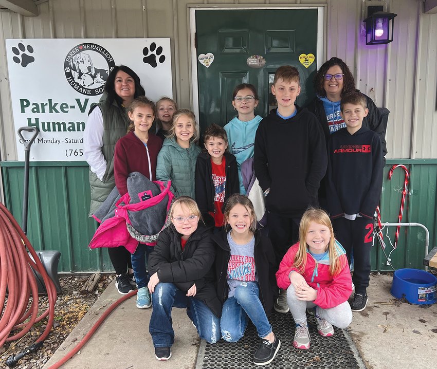 Members of the Turkey Run Elementary Student Lighthouse Team recently held a PAW-ty in honor of Finley&rsquo;s birthday. Finley is the school&rsquo;s service dog. TRES students and staff donated items such as pet food, treats and toys, cat litter, paper towels and dish soap. As a part of this activity, members delivered the items to the Parke- Vermillion Co. Humane Society. While there, they were able to visit with the pets. Bethany Tidwell&rsquo;s class donated the most items. There were 245 items collected. The first grade students enjoyed having Finley spend some in their classroom as a thank you for their donations. Pictured are front row, Savanna York, Rebel Roemer and Javelin Wallace; middle row, Taylor Snell, Abby Hill, Havik Roemer, Luke Mauntel and Jaxson Woods; and back row, Jill Ferguson, Cobie McCrory, Julia Helderman and Rachael Leach.