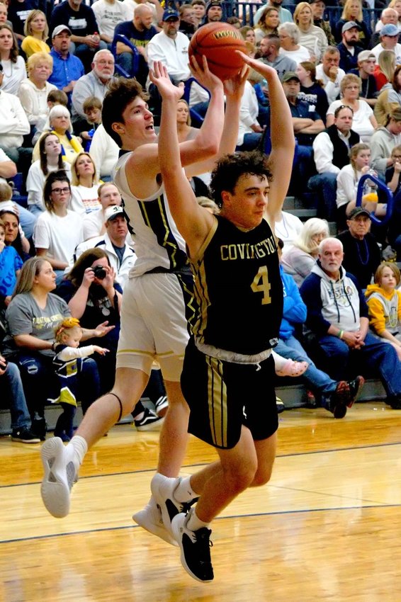 Will Harmon shoots an athletic floater over Covington on Thursday during Fountain Central's 37-32 win over the Trojans.