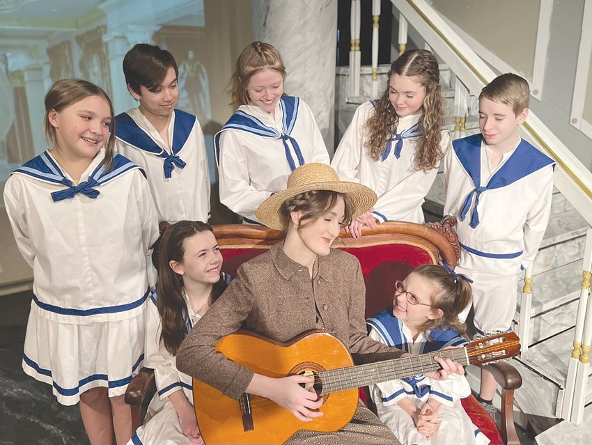 Photo Provided   Maria and the Von Trapp children have a sing-along in Myers Dinner Theatre&rsquo;s production of Rodgers and Hammerstein&rsquo;s The Sound of Music. Pictured are, from left, front row, Greta Shambarger, Ruthie Sangster and Adelaide Klinger; and back row, Kinley Barney, Charlie L. Chalmers, DRae Beller, Emery Jane Allen and Eli Miller.