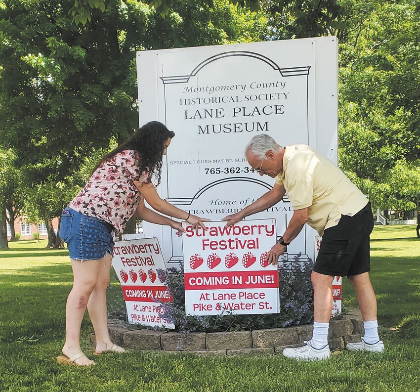 The 49th annual Crawfordsville Strawberry Festival is just one weekend away, June 9-11. Festival Chairman S. David Long and Sierra Hutchison spent time Thursday lining the Lane Place venue with Strawberry Festival signs.