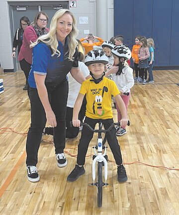 Yamaha team members and riders visited Pleasant Hill Elementary School on Monday to announce the bike program to kindergarten students.