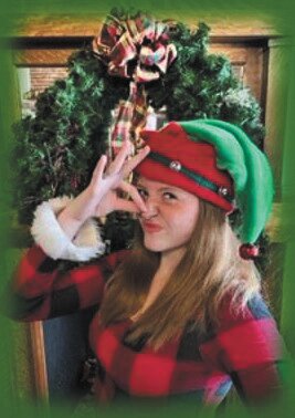 Junie B. (DRae Beller) prepares for the big Holiday Sing-Along and Secret Santa gift exchange in Junie B. in Jingle Bells, Batman Smells! at Myers Dinner Theatre in Hillsboro.