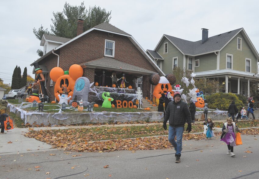 Families brave the cold temperatures Tuesday to trick-or-treat along Main Street in Crawfordsville.