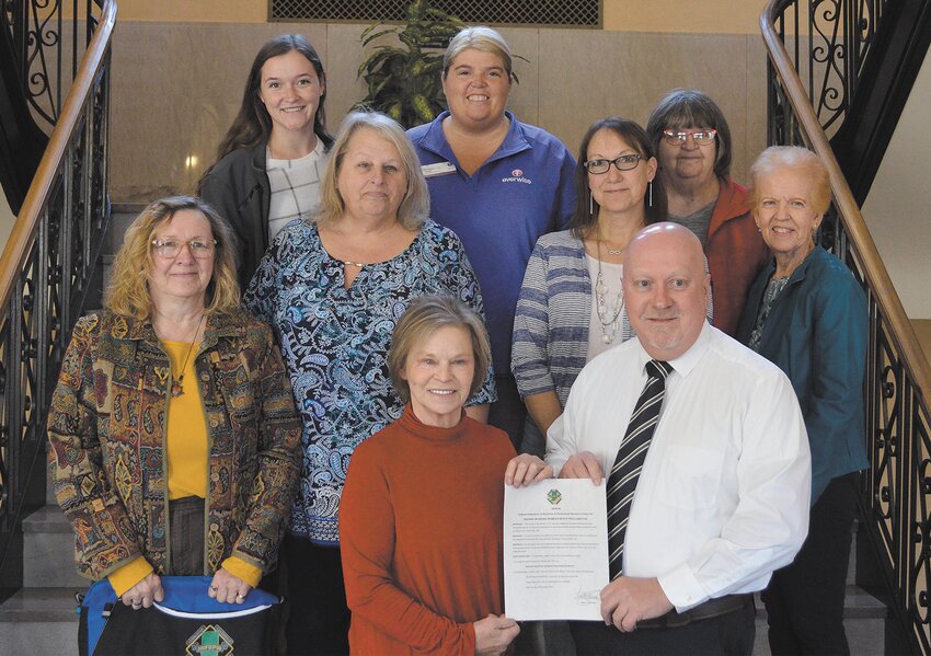 Pictured, from left, are front row, Kym Bushong and Mayor Todd Barton; middle row, Sandra Henderson, Patti Harvey, Michele Enlow and Nancy Gegner; and top row, Ellen Laffoon, Brittany Carr and Julie Cerny. Not pictured are Kathy Smith and Jill Jarvis.