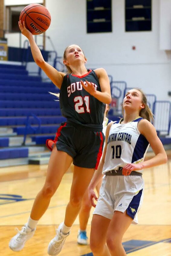 DeLorean Mason of Southmont - scooping a lay-up around Brailey Hoagland of Fountain Central