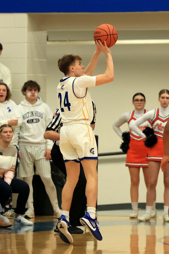 Sophomore Mason McCarty lines up this three points shot for Crawfordsville as he got his first taste of the Cville/North rivalry on Friday.