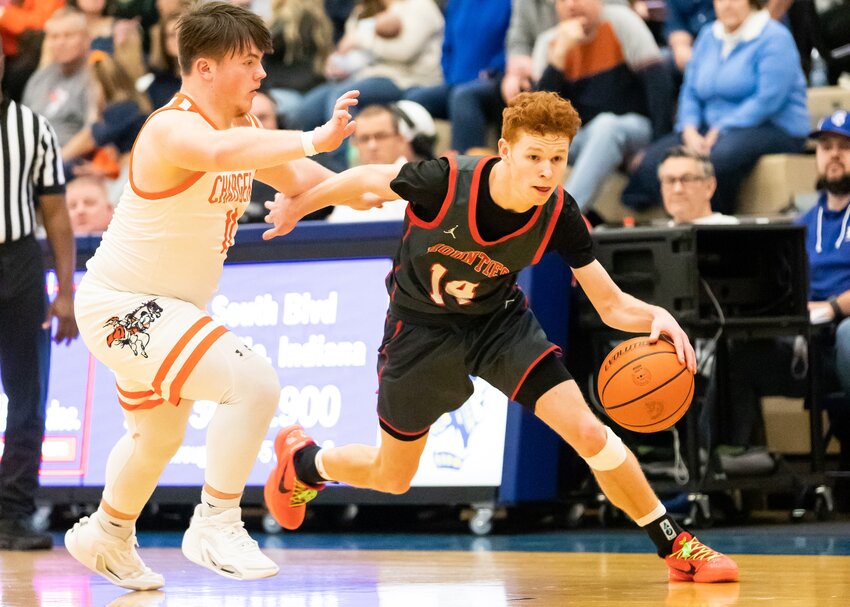 Hayden Hess looks to drive on Ross Dyson. The Mounties were able to take down North Montgomery 48-35 to advance to the championship of the 17th Boys Sugar Creek Classic.