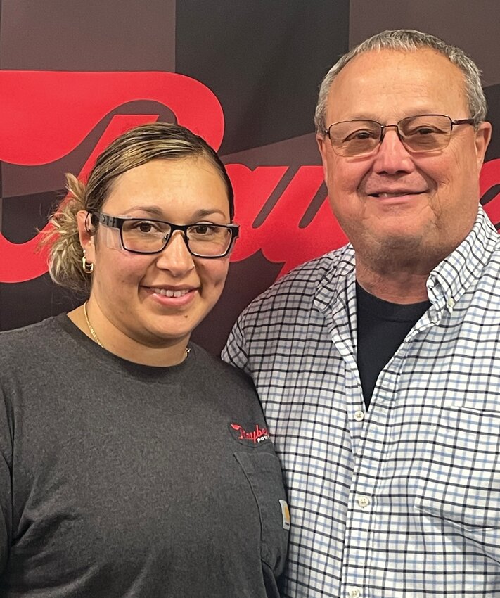 Ibeth Giron, left, will mark 10 years at Raybestos Powertrain today. She is pictured with Tim Pearson.