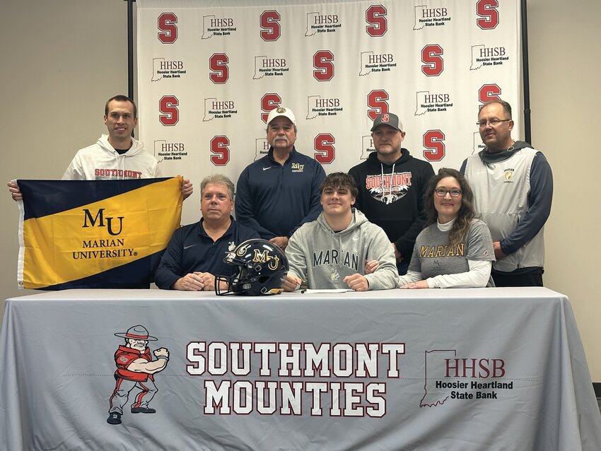 Southmont&rsquo;s Wyatt Woodall signed on Monday to continue his football career with the Marian Knights and was joined by members of the Knight&rsquo;s coaching staff, Southmont coach Desson Hannum, and his family.