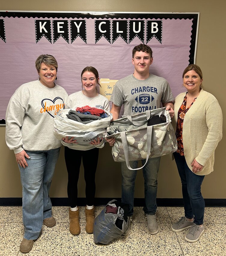 Pictured, from left, are Megan Oppy, Sophia Powell, Corbin Meadows and Elise Israel with clothes already donated to Thoughtful Threads.